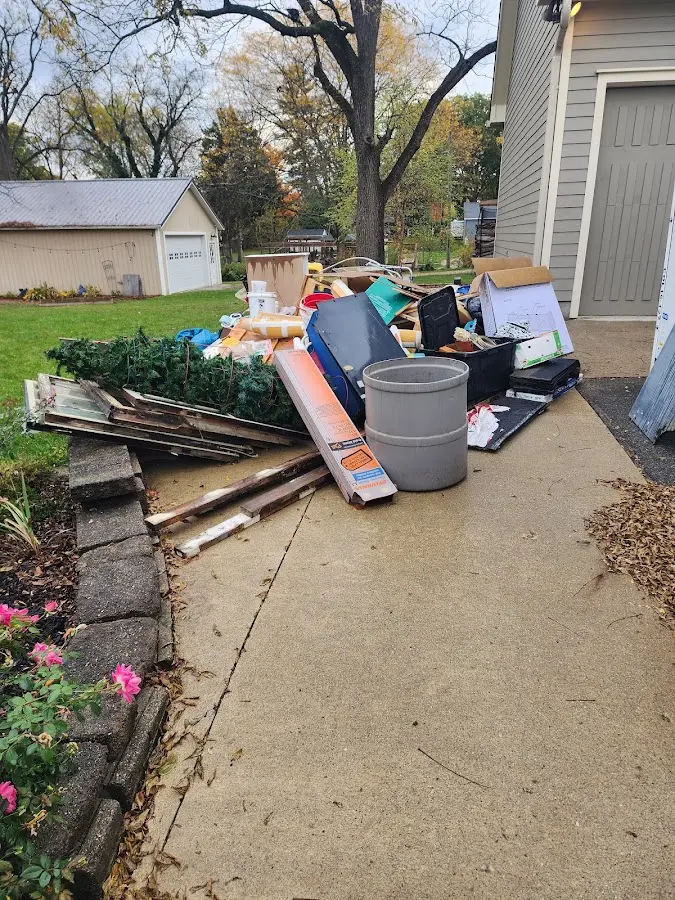 Dumpster being loaded with debris for Residential Dumpster Rental in Stanton